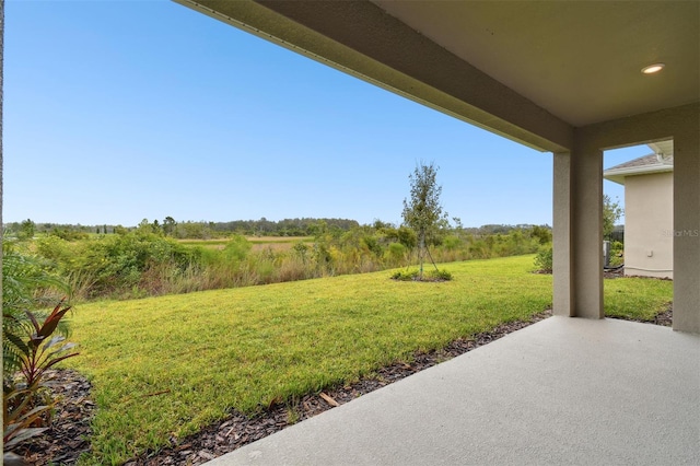 view of yard with a patio and a rural view