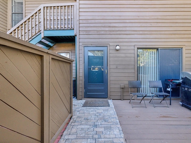 entrance to property with a wooden deck