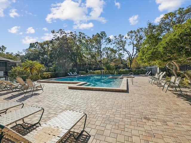 view of swimming pool featuring a patio area