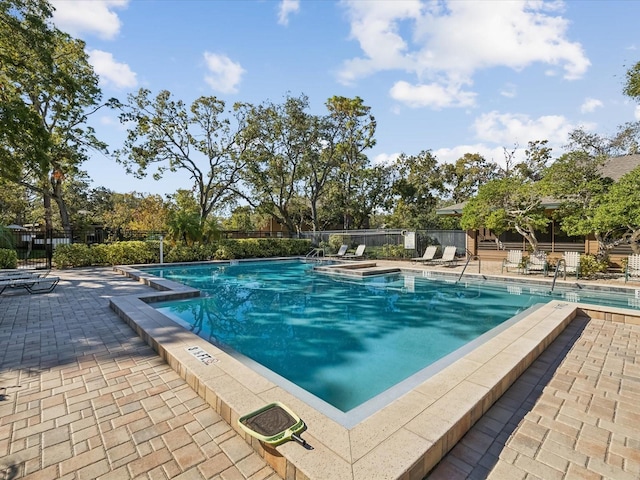 view of swimming pool with a patio