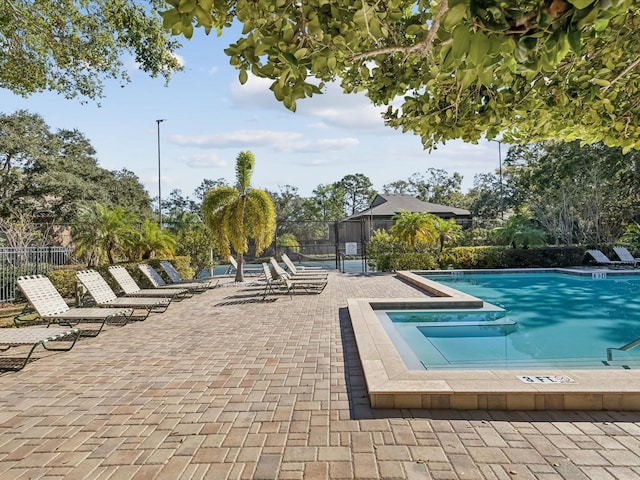 view of swimming pool with a patio