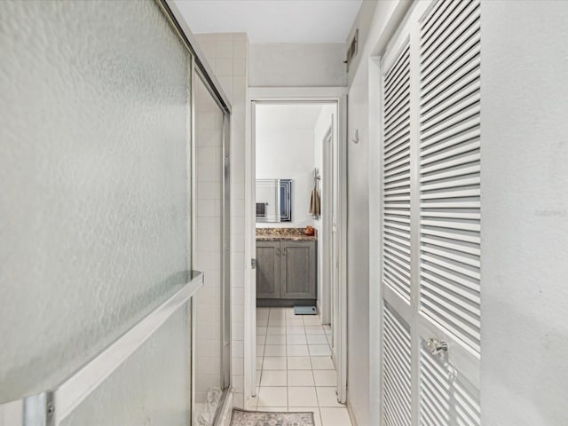 corridor featuring light tile patterned floors