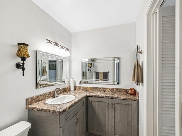 bathroom with vanity and toilet