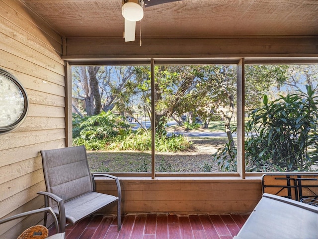 sunroom with wooden ceiling and a healthy amount of sunlight