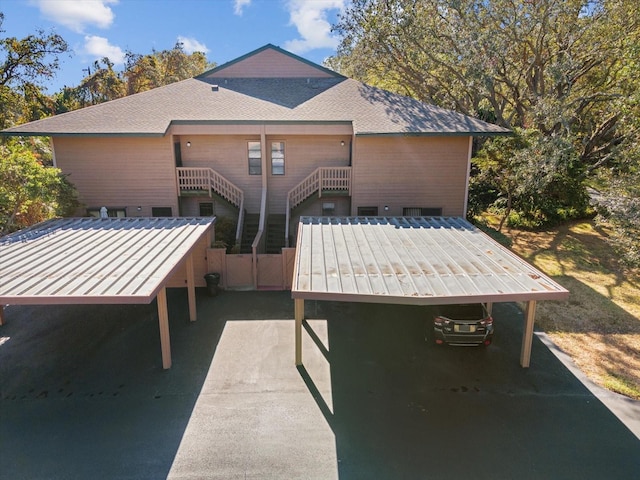 1901 Lennox Rd E Unit 1901, Palm Harbor, FL 34683 - view of patio / terrace with stairs and a carport