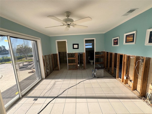 unfurnished room with ceiling fan and crown molding