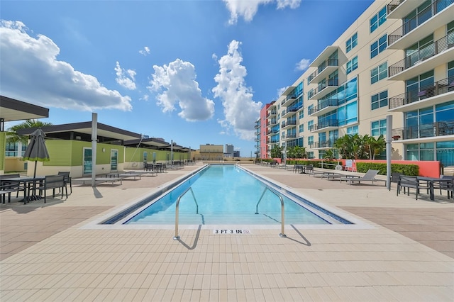 view of swimming pool featuring a patio area