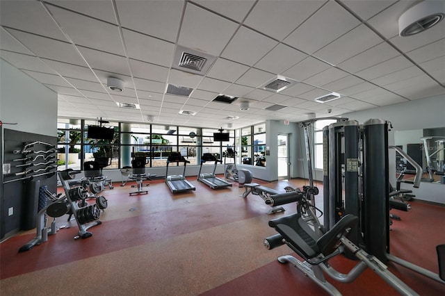 workout area featuring a paneled ceiling