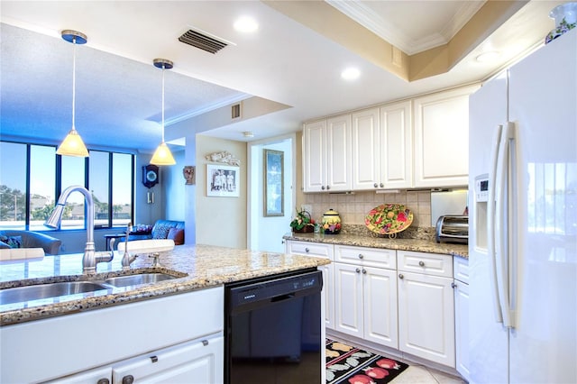 kitchen featuring white cabinets, sink, hanging light fixtures, white fridge with ice dispenser, and black dishwasher