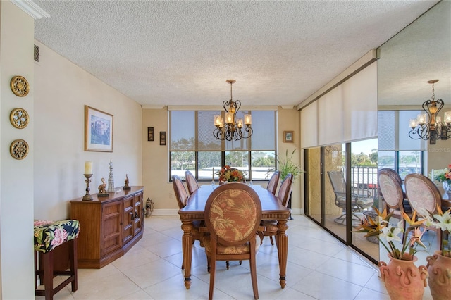 tiled dining space featuring a notable chandelier, plenty of natural light, and a textured ceiling