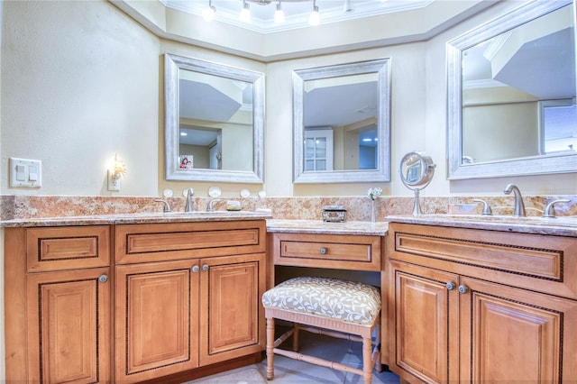 bathroom with vanity and ornamental molding