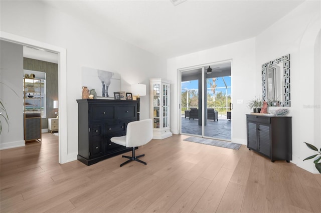 office area with light hardwood / wood-style floors