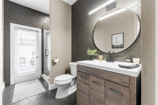 bathroom featuring tile patterned floors and tile walls