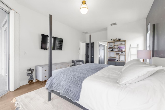 bedroom with light hardwood / wood-style floors