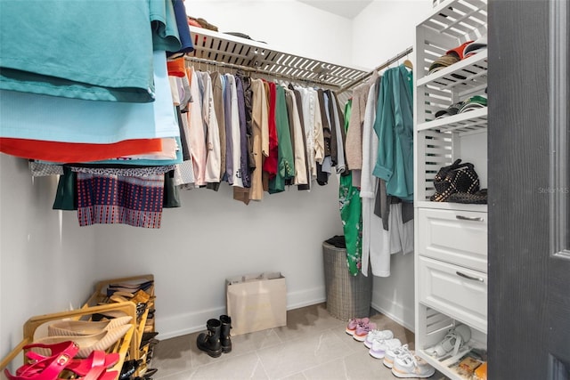 walk in closet featuring light tile patterned floors