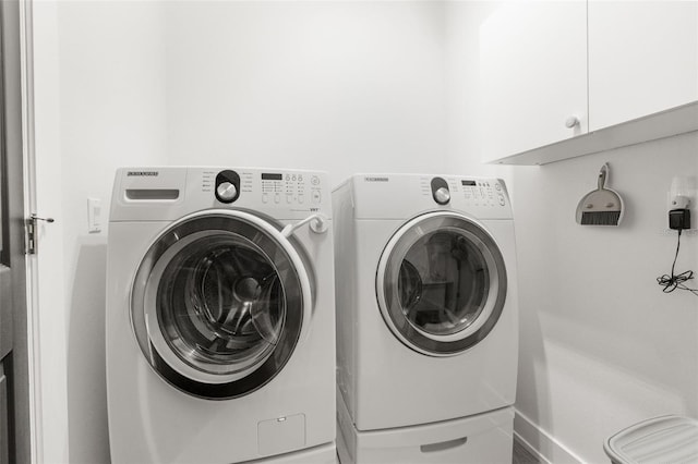 laundry area with cabinets and independent washer and dryer