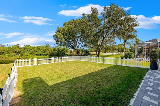 view of yard with a lanai