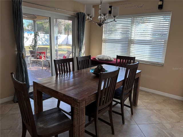 tiled dining space with a notable chandelier