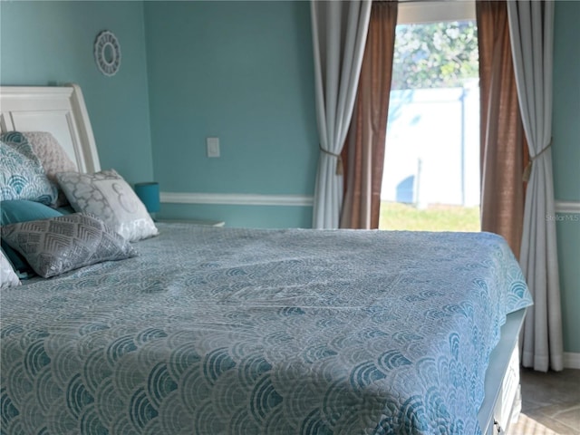 bedroom featuring multiple windows