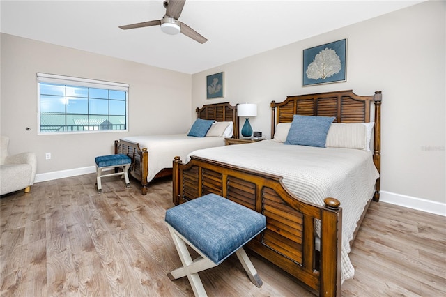 bedroom featuring ceiling fan and light hardwood / wood-style floors