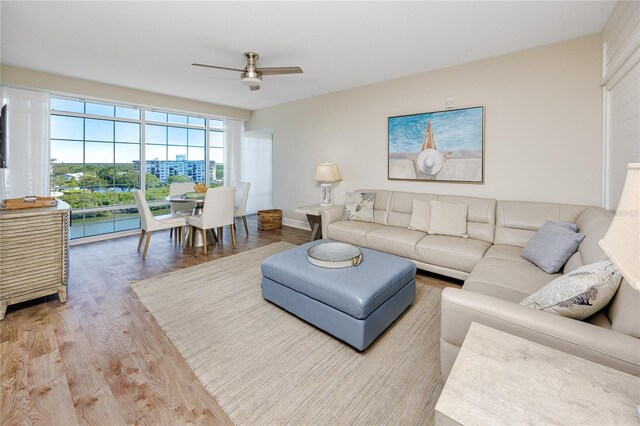 399 2nd St Unit 718, Indian Rocks Beach, FL 33785 - living area with wood finished floors, ceiling fan, and baseboards