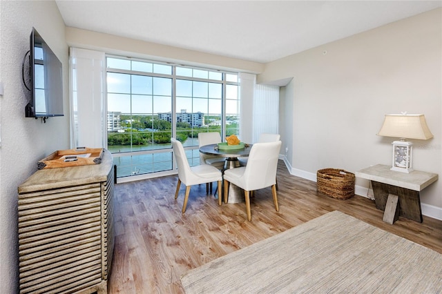 dining area featuring hardwood / wood-style flooring