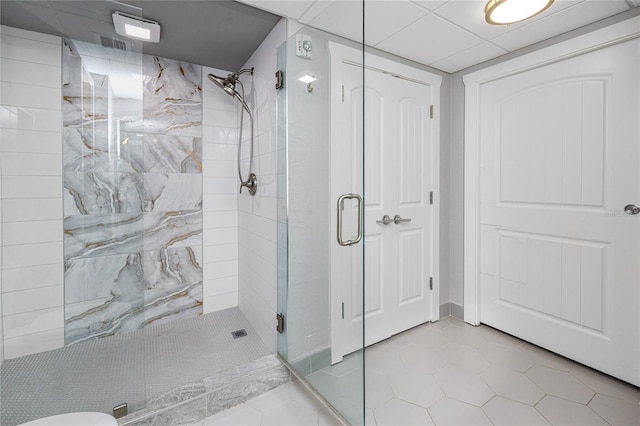 bathroom with tile patterned flooring and an enclosed shower