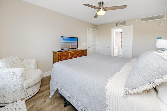 bedroom with ceiling fan and light hardwood / wood-style flooring