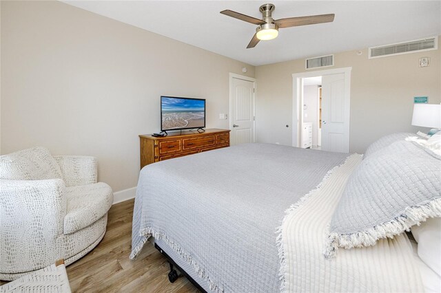 399 2nd St Unit 718, Indian Rocks Beach, FL 33785 - bedroom featuring light wood-style floors, ceiling fan, and baseboards