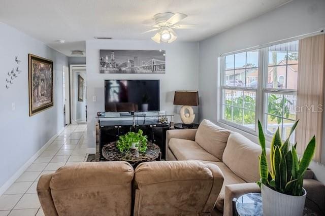 tiled living room with ceiling fan