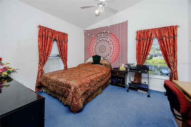 bedroom with carpet, a water view, ceiling fan, and lofted ceiling