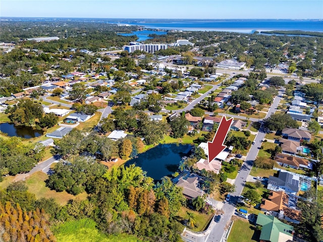 birds eye view of property featuring a water view