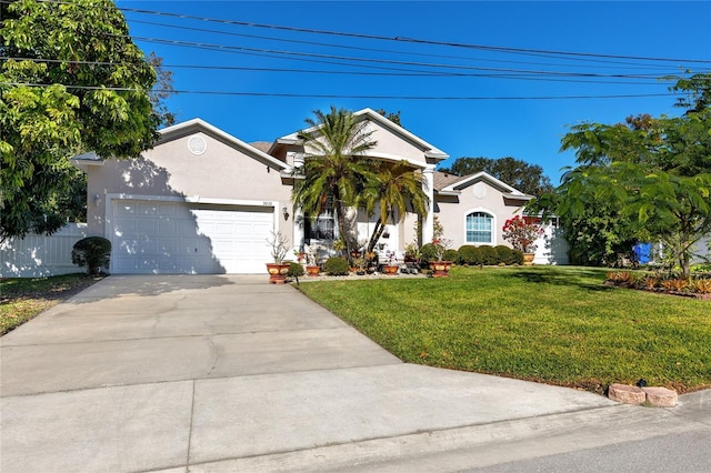 view of front of home featuring a garage and a front lawn