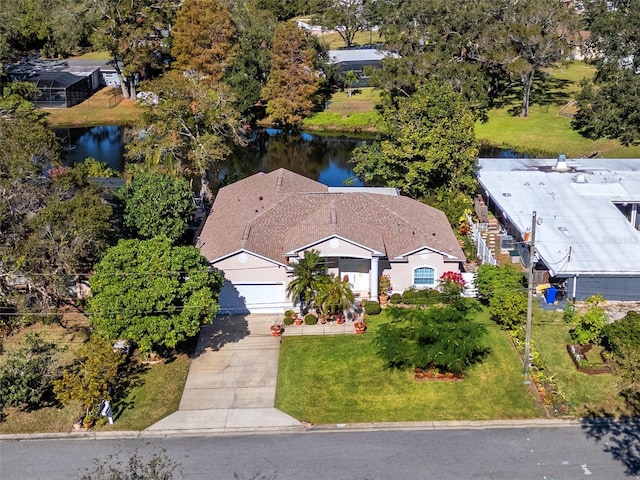 birds eye view of property with a water view