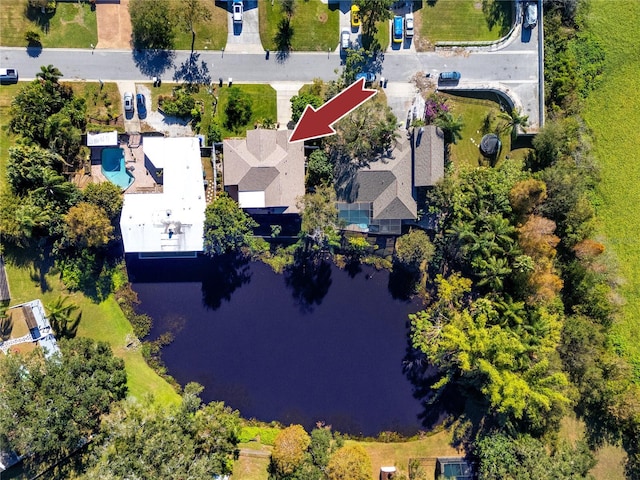 birds eye view of property with a water view