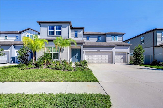 view of front of home featuring a front yard and a garage