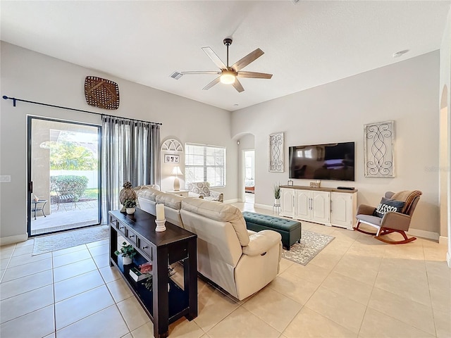 living room featuring ceiling fan and light tile patterned flooring