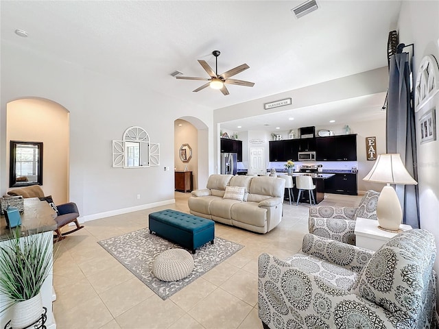 living room featuring ceiling fan and light tile patterned floors