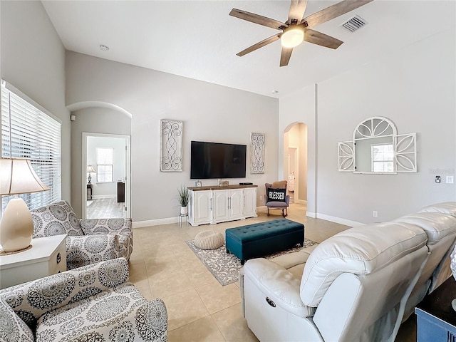 tiled living room featuring ceiling fan