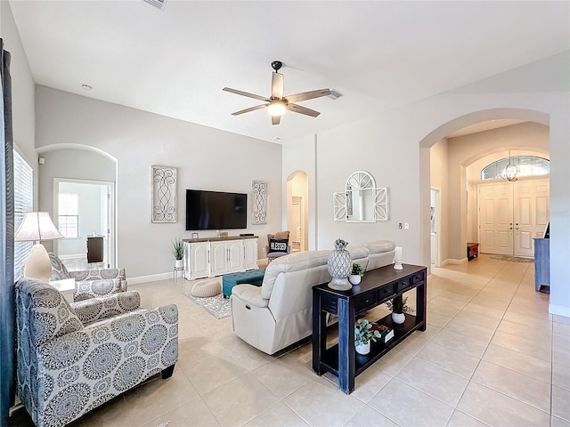 tiled living room featuring ceiling fan