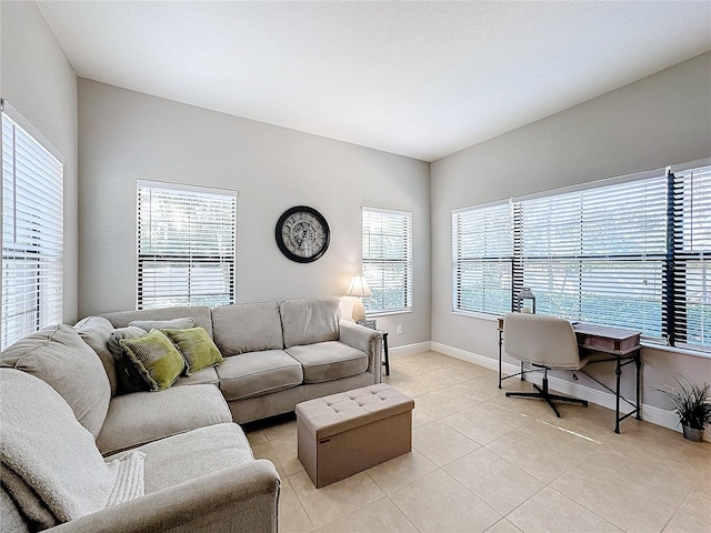 tiled living room with plenty of natural light