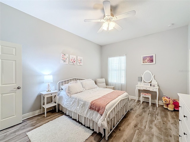 bedroom featuring ceiling fan and light wood-type flooring