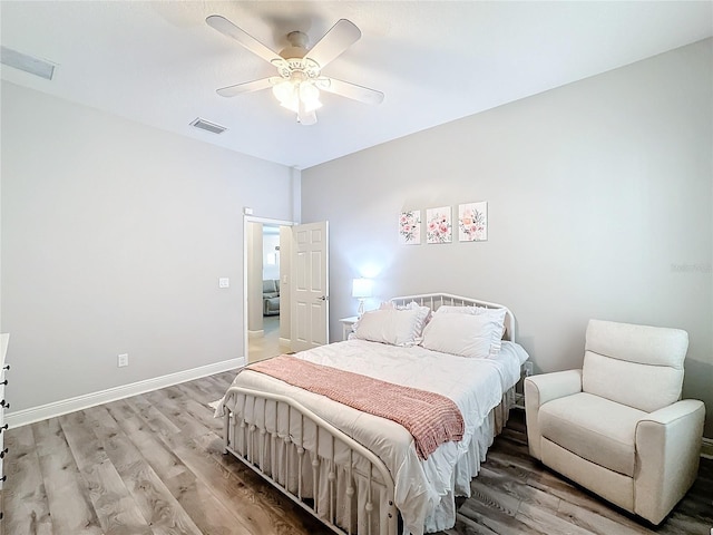 bedroom featuring light hardwood / wood-style floors and ceiling fan