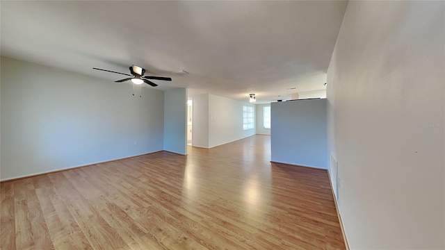 unfurnished room featuring ceiling fan and light wood-type flooring