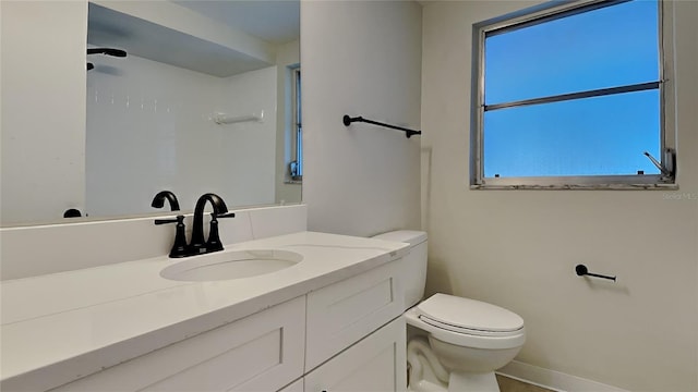 bathroom with vanity and toilet