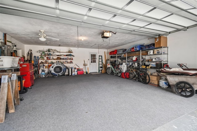 garage featuring ceiling fan and a garage door opener