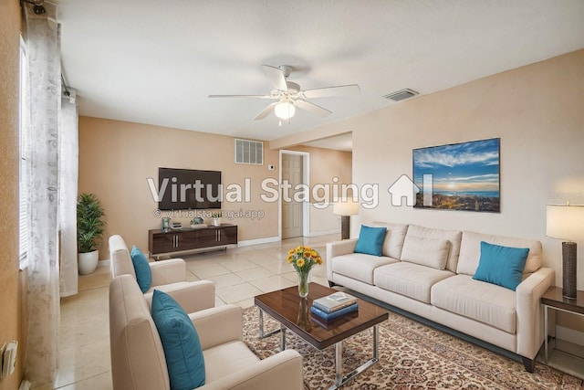 living room featuring light tile patterned floors and ceiling fan