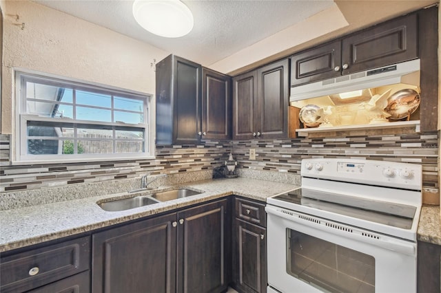 kitchen featuring sink, white electric range, a textured ceiling, decorative backsplash, and dark brown cabinets