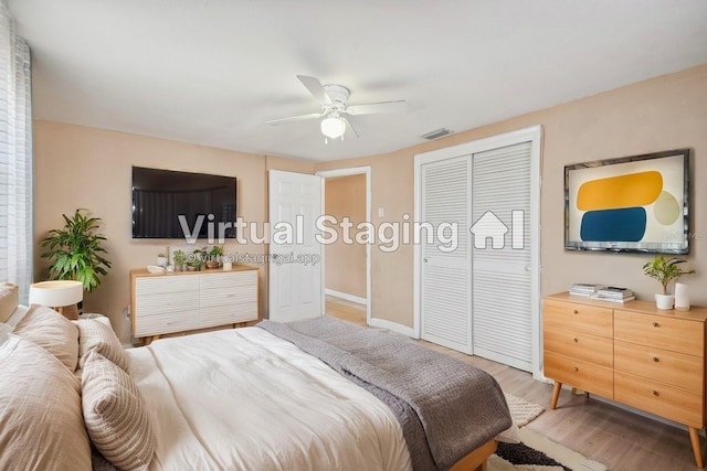 bedroom featuring ceiling fan, wood-type flooring, and a closet