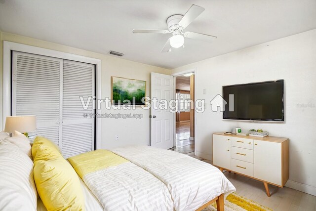 bedroom featuring a closet, ceiling fan, and light hardwood / wood-style floors